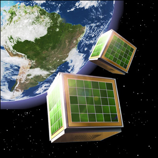 The graphic shows two cube satellites, or CubeSats, orbiting around Earth, which is shown far off in the background. The graphic shows two cube satellites, or CubeSats, orbiting around Earth, which is shown far off in the background.