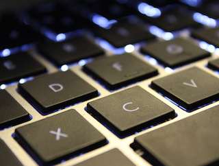 A black backlit keyboard. A black backlit keyboard.