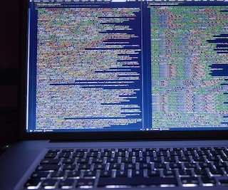 Photo of HTML text on a computer monitor. Photo of HTML text on a computer monitor.