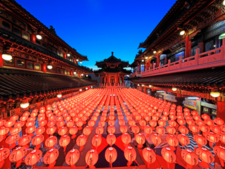 A picture at a Chinese temple with a lot of red lanterns with a blue sky background. A picture at a Chinese temple with a lot of red lanterns with a blue sky background.