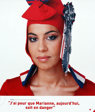 A Muslim woman dressed as Marianne wearing a phrygian cap. Text below reads 'I'm afraid Marianne today is in danger'. A Muslim woman dressed as Marianne wearing a phrygian cap. Text below reads 'I'm afraid Marianne today is in danger'.