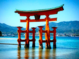 An oriental red wooden structure standing in a lake surrounding with mountains An oriental red wooden structure standing in a lake surrounding with mountains