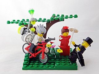 A LEGO® model of a young man on a bike, with a huge clock attached to his back, pointing a gun at an elegantly-dressed older gentleman. A LEGO® model of a young man on a bike, with a huge clock attached to his back, pointing a gun at an elegantly-dressed older gentleman.