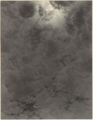 The sun shining through a layer of clouds. The sun shining through a layer of clouds.