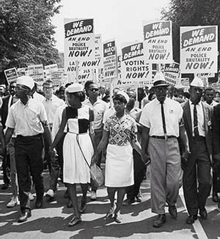 A group of picketers carrying protest signs. A group of picketers carrying protest signs.
