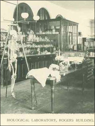 An old photograph from a biology lab at MIT in the 1800s. There is a skeleton in the foreground. An old photograph from a biology lab at MIT in the 1800s. There is a skeleton in the foreground.
