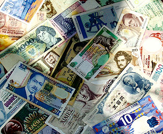 A collage of currency from countries around the world. A collage of currency from countries around the world.