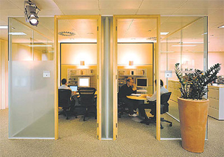 Employees working and holding meetings in modern office building. Employees working and holding meetings in modern office building.