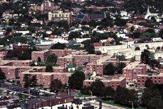 An aerial photo of many large brick apartment buildings. An aerial photo of many large brick apartment buildings.