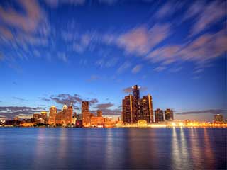 A photo of Detroit, Michigan, taken at sunset from the river. A photo of Detroit, Michigan, taken at sunset from the river.