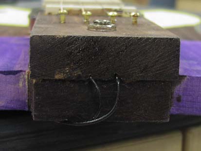 Close-up of tailpiece and bottom of guitar.