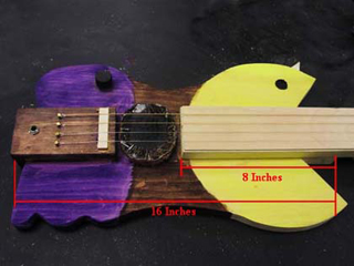 Electric guitar shaped like pac-man. Electric guitar shaped like pac-man.