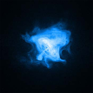 This is an image of the Crab Nebula. It is bright blue and shaped like a bell against a black background. This is an image of the Crab Nebula. It is bright blue and shaped like a bell against a black background.