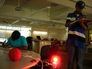A red bulb illuminates a small ball.