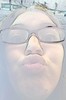 A photo of a girl with glasses.