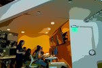 A photo of students working at computers in a classroom.